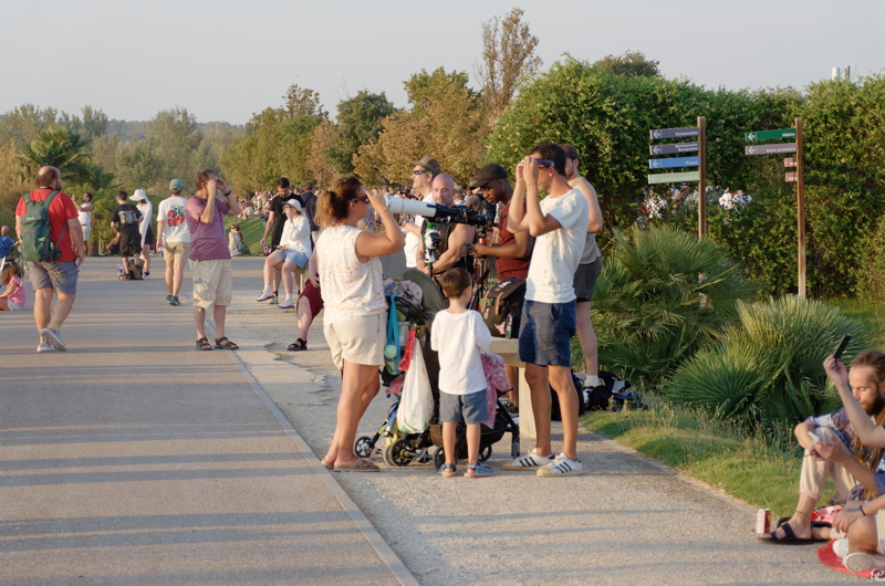 Groups of people with optical and electronic equipment awaiting the solar eclipse astronomical event in Spain in 2026 - image 1